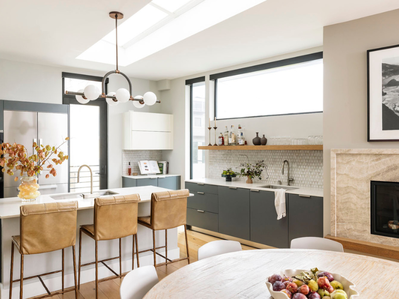 modern kitchen with barstools, modern fixtures, and beautiful tile backsplash