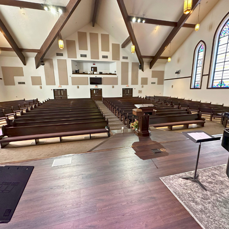 Dark wood flooring on a church sanctuary stage.