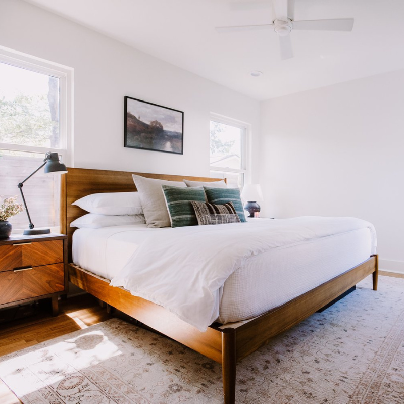 Light, airy minimalist bedroom with rustic decor