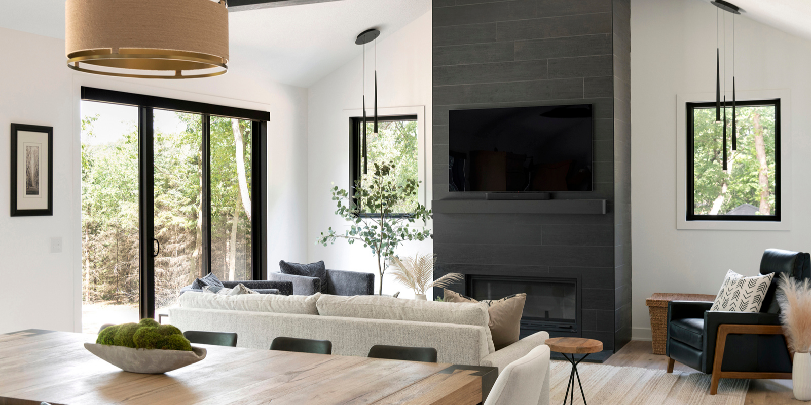 Modern kitchen with black cabinets and black and white patterned tile